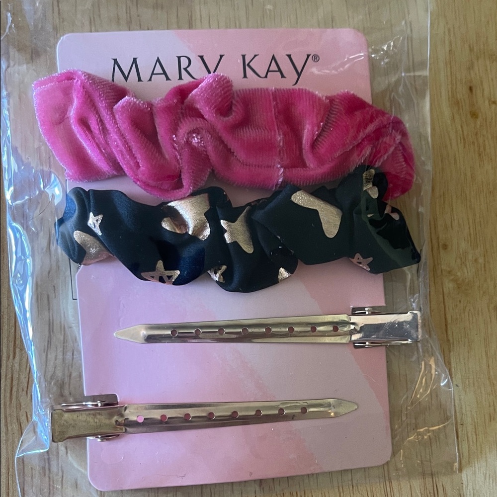 Pink and black hair scrunchies. Also comes with clips.